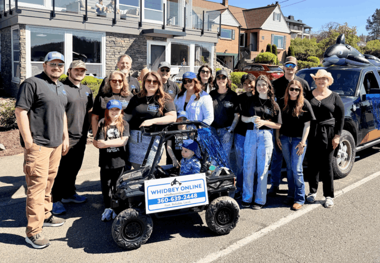 Whidbey Online team smiling for a photo together.